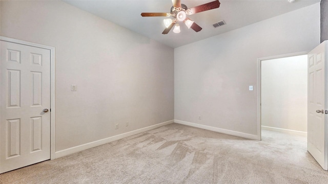 carpeted empty room featuring ceiling fan