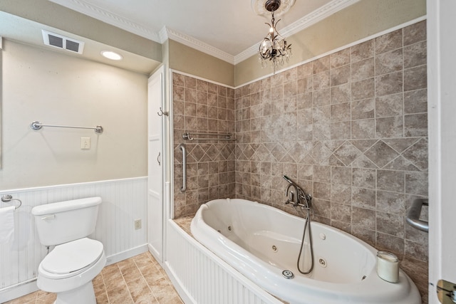 bathroom featuring ornamental molding, a bathing tub, tile patterned flooring, and toilet