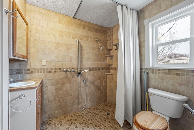 bathroom with toilet, tile walls, a shower with shower curtain, and vanity