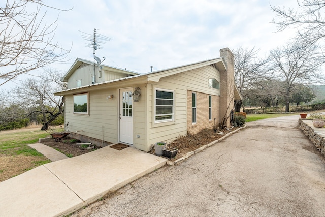 bungalow-style home with a patio area