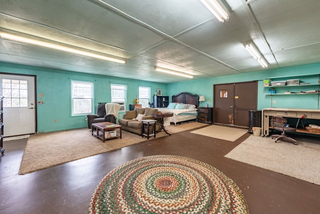 bedroom featuring concrete floors