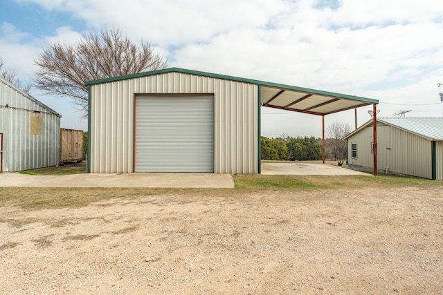 garage featuring a carport