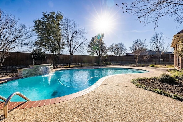 view of swimming pool featuring a patio area, a fenced backyard, and a fenced in pool