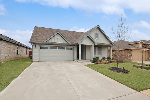 view of front facade with an attached garage, a front lawn, and board and batten siding