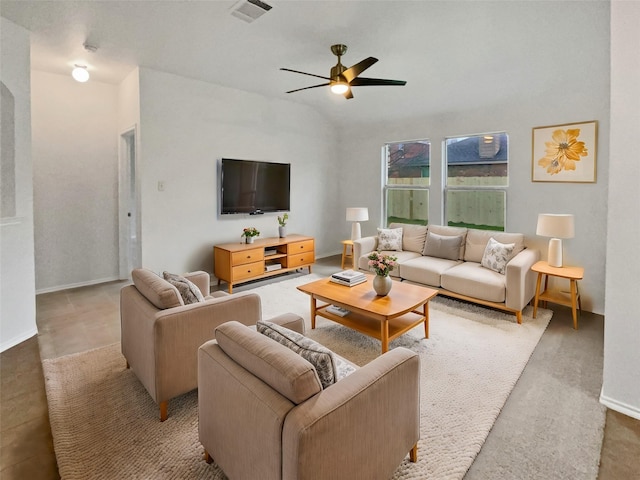 living room with lofted ceiling, visible vents, ceiling fan, and baseboards