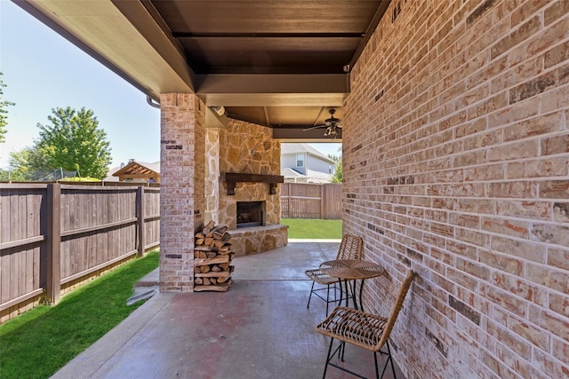 7621 Glenwood Springs Ln, Mckinney, TX 75070 - fenced backyard with an outdoor stone fireplace and a patio area
