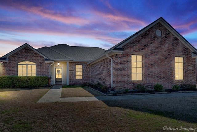 view of front of property with a yard