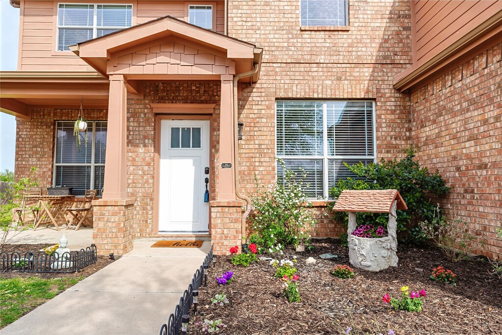 13232 Austin Stone Dr, Fort Worth, TX 76052 - doorway to property with covered porch and brick siding