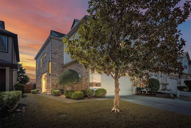 property exterior at dusk featuring a garage and a lawn