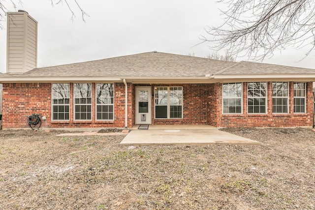 back of property featuring a patio