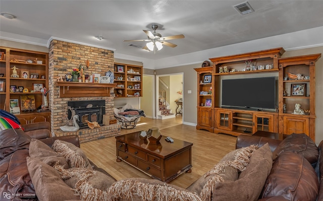 living room featuring ceiling fan, light hardwood / wood-style flooring, and ornamental molding