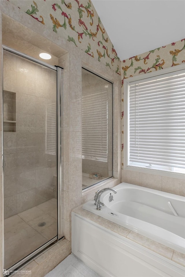 bathroom featuring vaulted ceiling and plus walk in shower