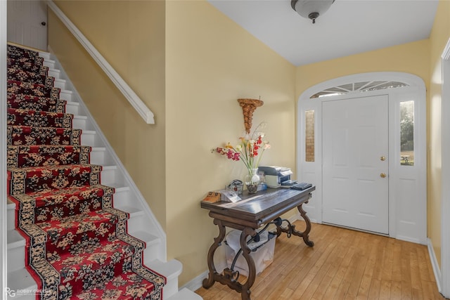 foyer entrance with light hardwood / wood-style floors