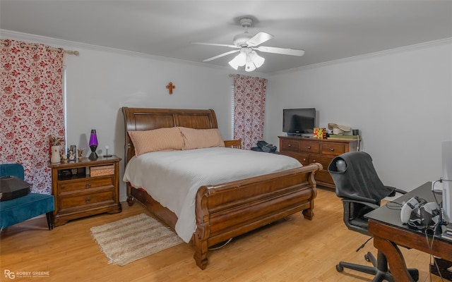 bedroom featuring light wood-type flooring, crown molding, and ceiling fan