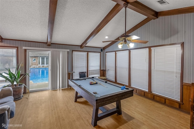 playroom with billiards, light hardwood / wood-style flooring, vaulted ceiling with beams, ceiling fan, and a textured ceiling