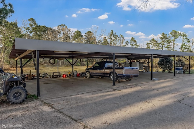 view of parking / parking lot featuring a carport