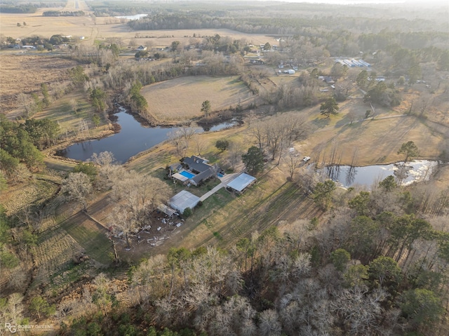 birds eye view of property featuring a rural view and a water view