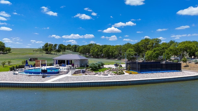 back of house featuring a water view