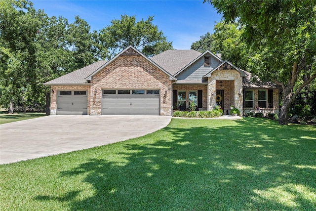 craftsman house with a garage and a front yard