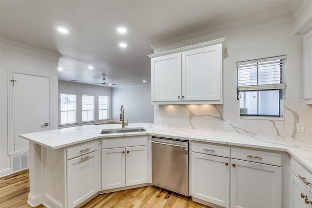 kitchen featuring sink, kitchen peninsula, white cabinets, and dishwasher