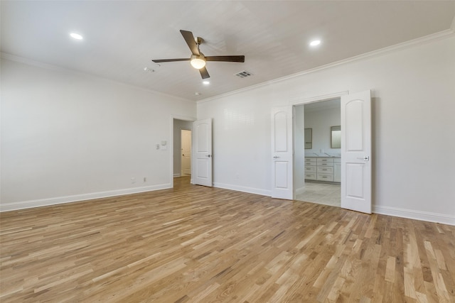 unfurnished bedroom with ceiling fan, ensuite bathroom, crown molding, and light hardwood / wood-style floors