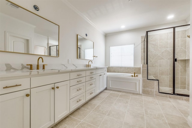 bathroom with vanity, tile patterned flooring, crown molding, and shower with separate bathtub