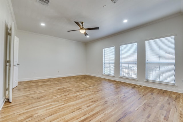 spare room with ceiling fan, crown molding, and light hardwood / wood-style floors