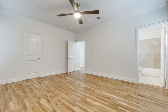 spare room featuring ceiling fan, light hardwood / wood-style floors, and crown molding