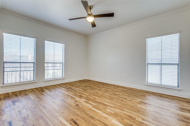 empty room featuring light wood-type flooring, crown molding, and ceiling fan