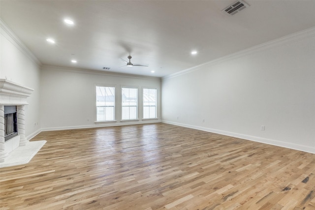 unfurnished living room featuring ceiling fan, light hardwood / wood-style flooring, and crown molding