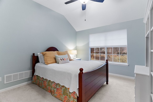 bedroom featuring light carpet, lofted ceiling, and ceiling fan