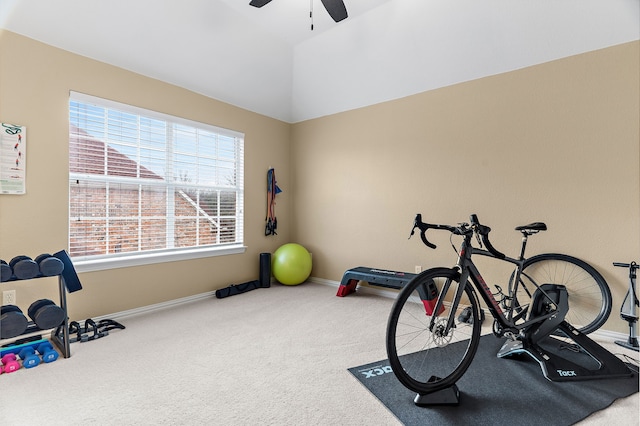 exercise room featuring ceiling fan, carpet, and lofted ceiling