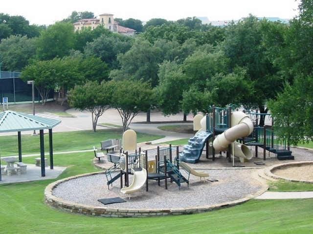 surrounding community featuring a playground and a yard