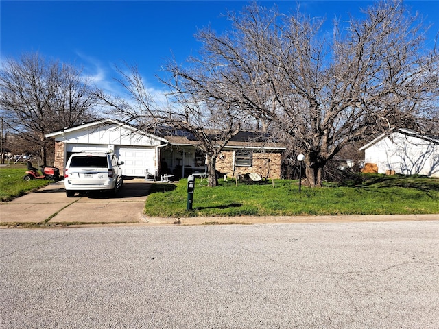 7801 Conn Dr, North Richland Hills, TX 76180 - view of front of property with a garage and a front lawn