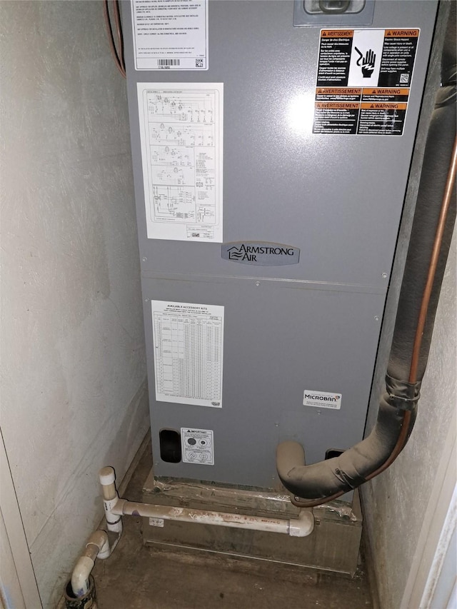 utility room with heating unit