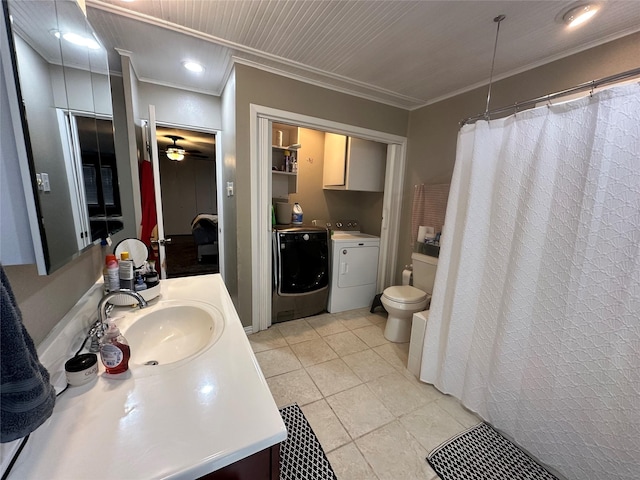 bathroom featuring toilet, tile patterned floors, ornamental molding, vanity, and separate washer and dryer