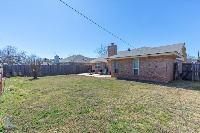 view of yard featuring a fenced backyard and a patio