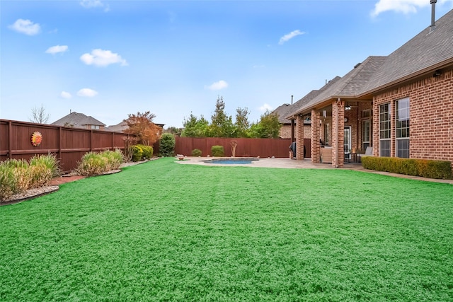 view of yard featuring a patio, a fenced backyard, and a fenced in pool