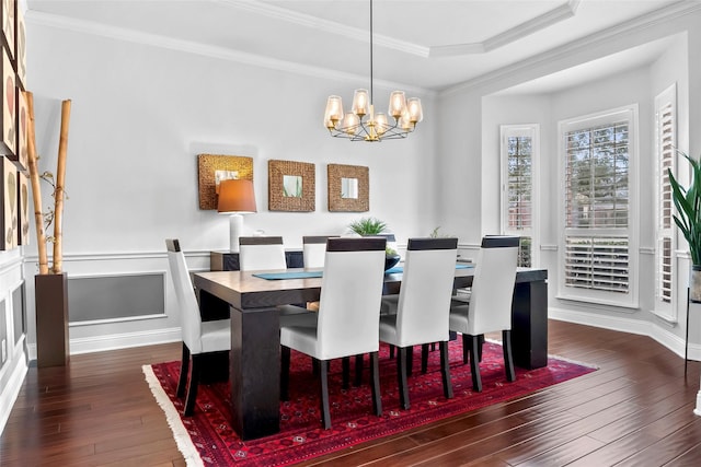 2418 Strathfield Ln, Trophy Club, TX 76262 - dining space with a tray ceiling, an inviting chandelier, wood-type flooring, and crown molding