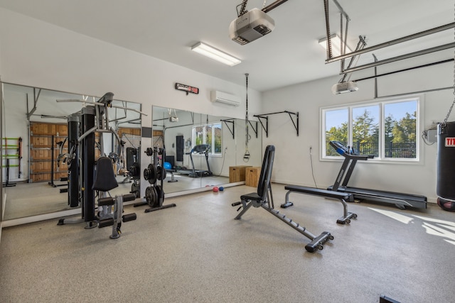 gym featuring plenty of natural light and a wall mounted AC