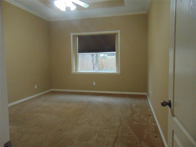 empty room with ornamental molding, light carpet, and ceiling fan