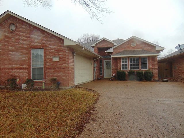 single story home with a garage