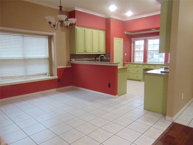 kitchen featuring an inviting chandelier, light tile patterned floors, ornamental molding, and kitchen peninsula