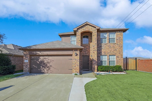 view of front of property featuring a garage and a front lawn