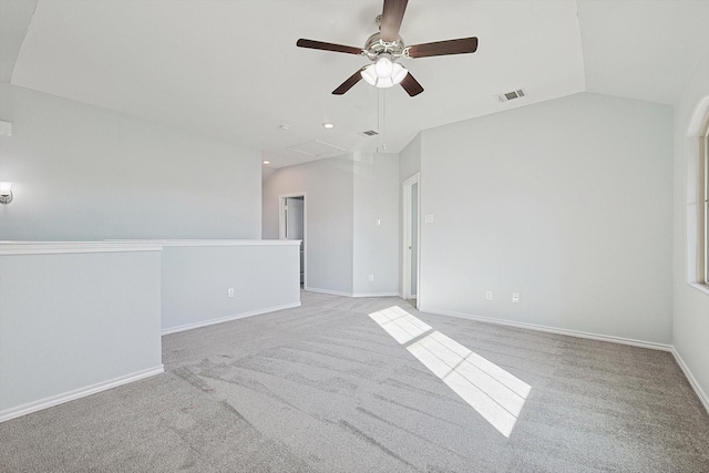 carpeted empty room featuring ceiling fan and lofted ceiling