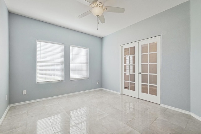 spare room featuring french doors and ceiling fan