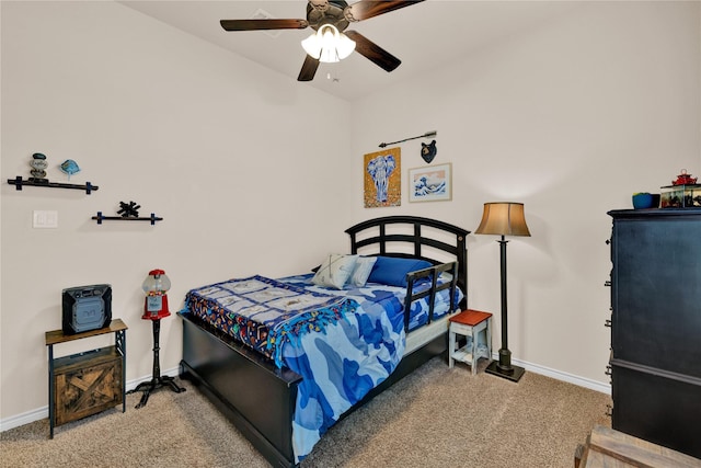 carpeted bedroom featuring ceiling fan and baseboards