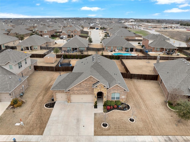 birds eye view of property with a residential view