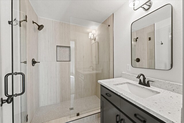 bathroom featuring vanity and walk in shower