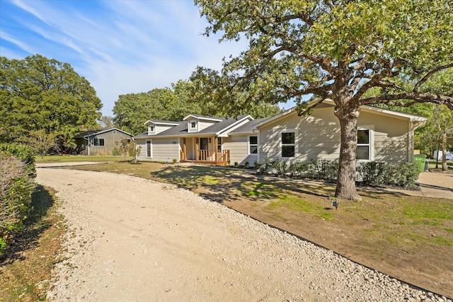 ranch-style home featuring covered porch